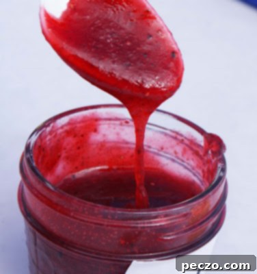 A close-up of 'Peppered Jam', a unique strawberry preserve with specks of black pepper, showcasing innovative flavor combinations.