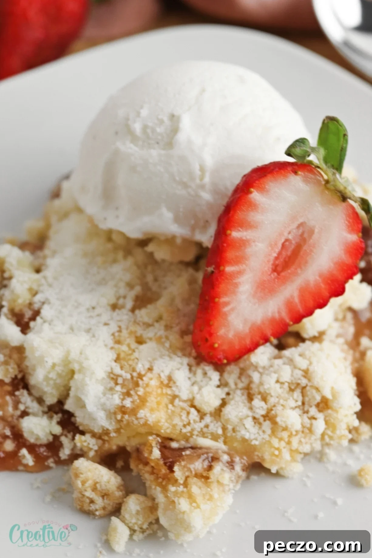 Strawberry cheesecake dump cake combines the fruity sweetness of strawberries with the creamy richness of cheesecake and the buttery crunch of cake mix.