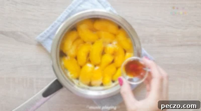 Adding vanilla extract to cooked peaches