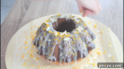 Glazing honey cake with almonds and zest